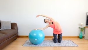 side bend on the ball for pregnancy stretch